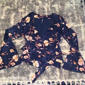 Free People faux wrap Navy Blue bell sleeve top with floral print